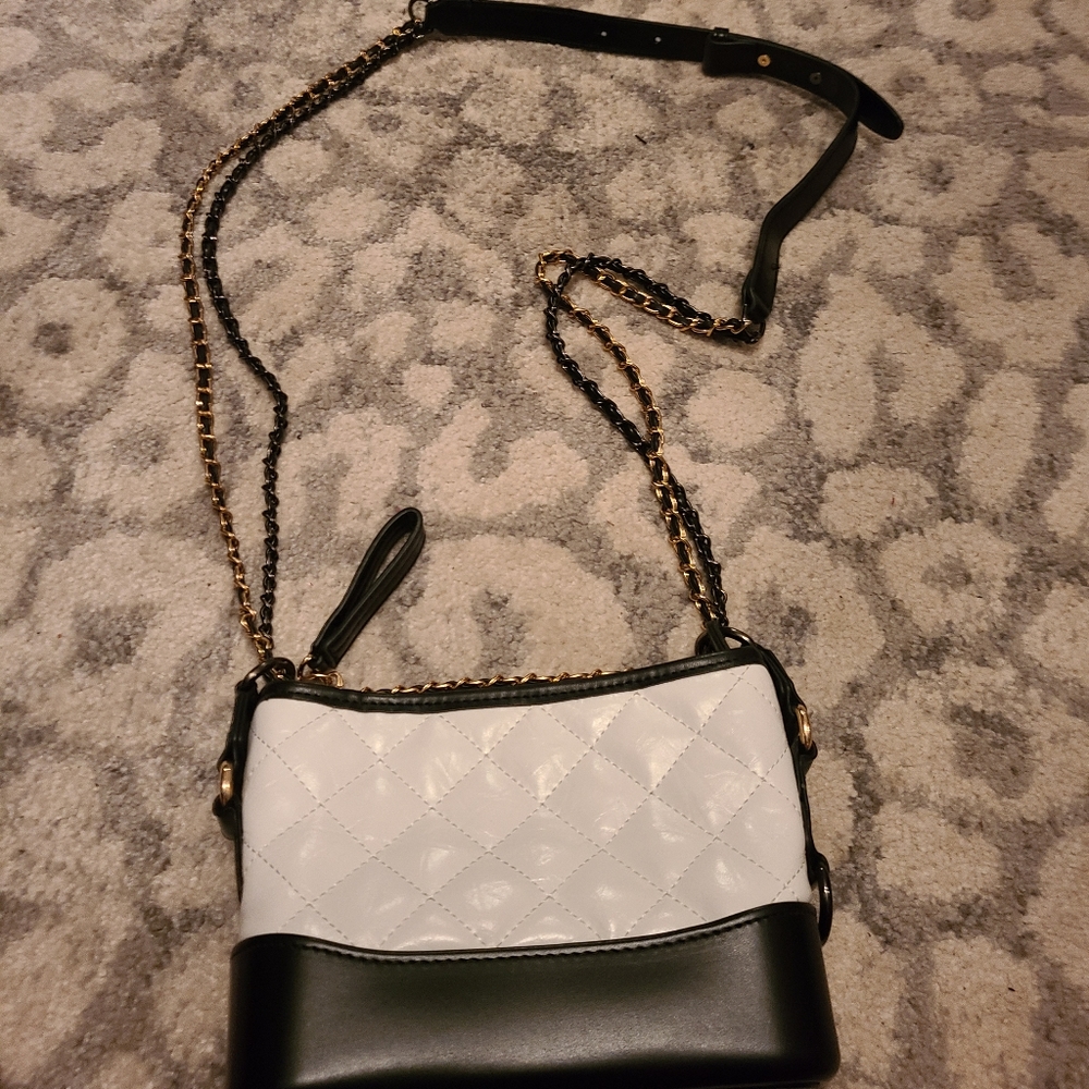 New without tags. Black and White bag with mixed metal hardware.